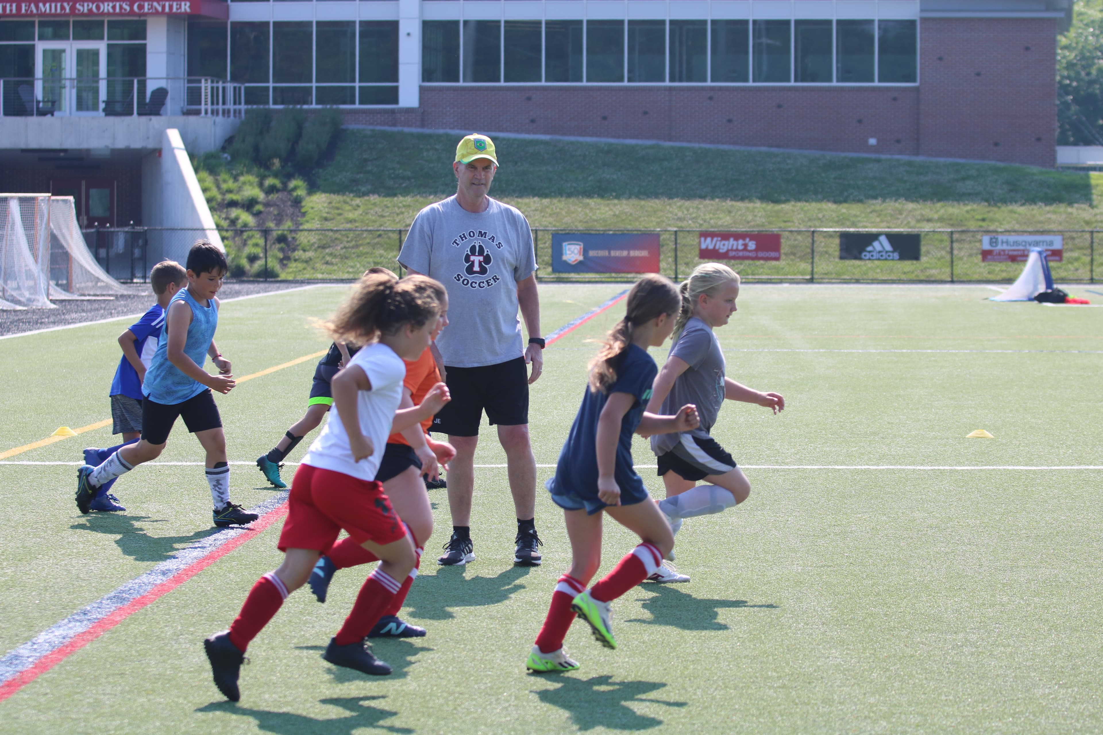 Evans Soccer Academy coach Ian Evans playing professional football with is team in Scotland